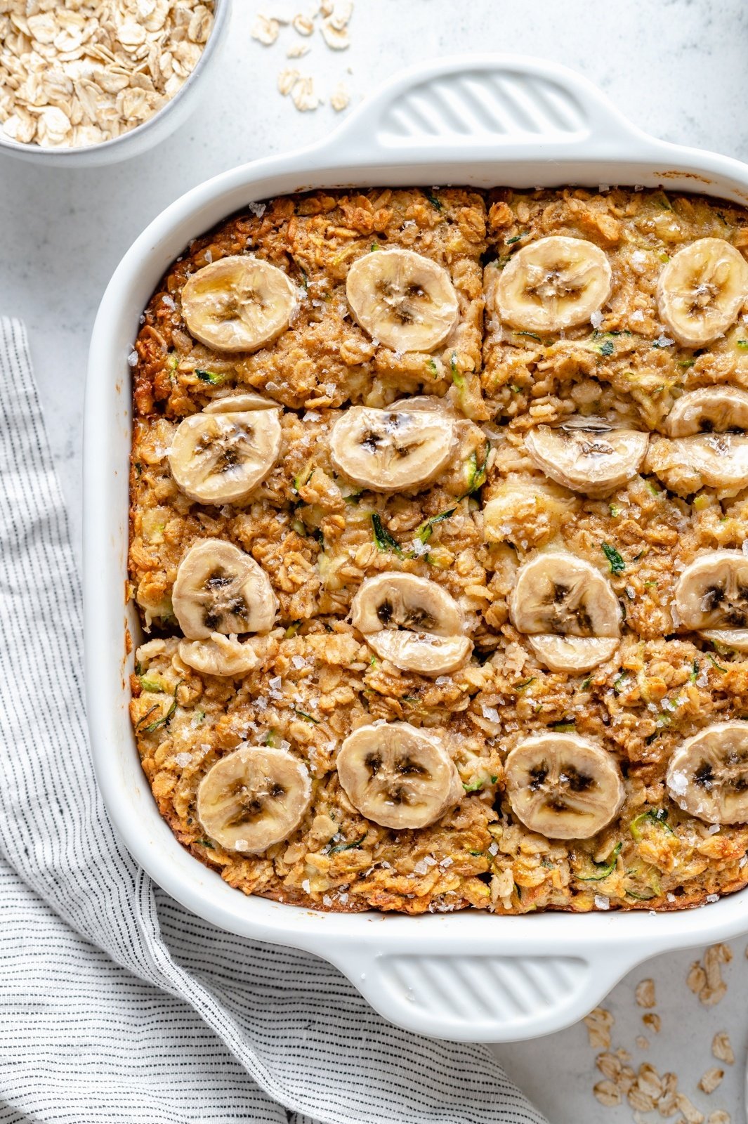 healthy banana zucchini baked oatmeal in a pan