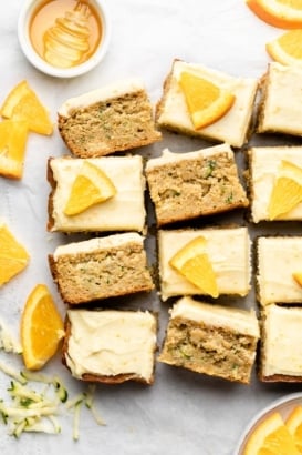 sliced orange zucchini cake on parchment paper